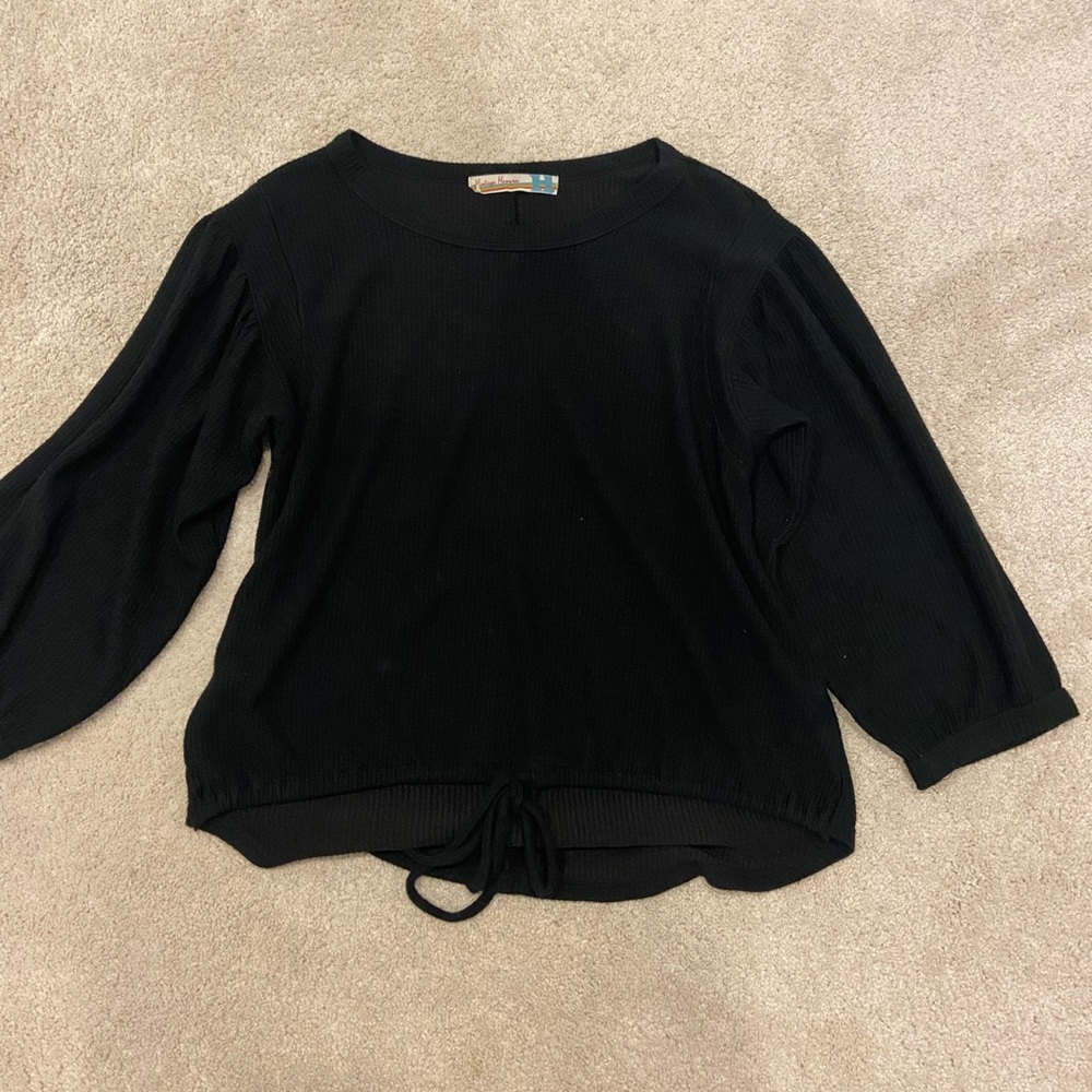 Black long sleeve shirt with tie at the bottom
